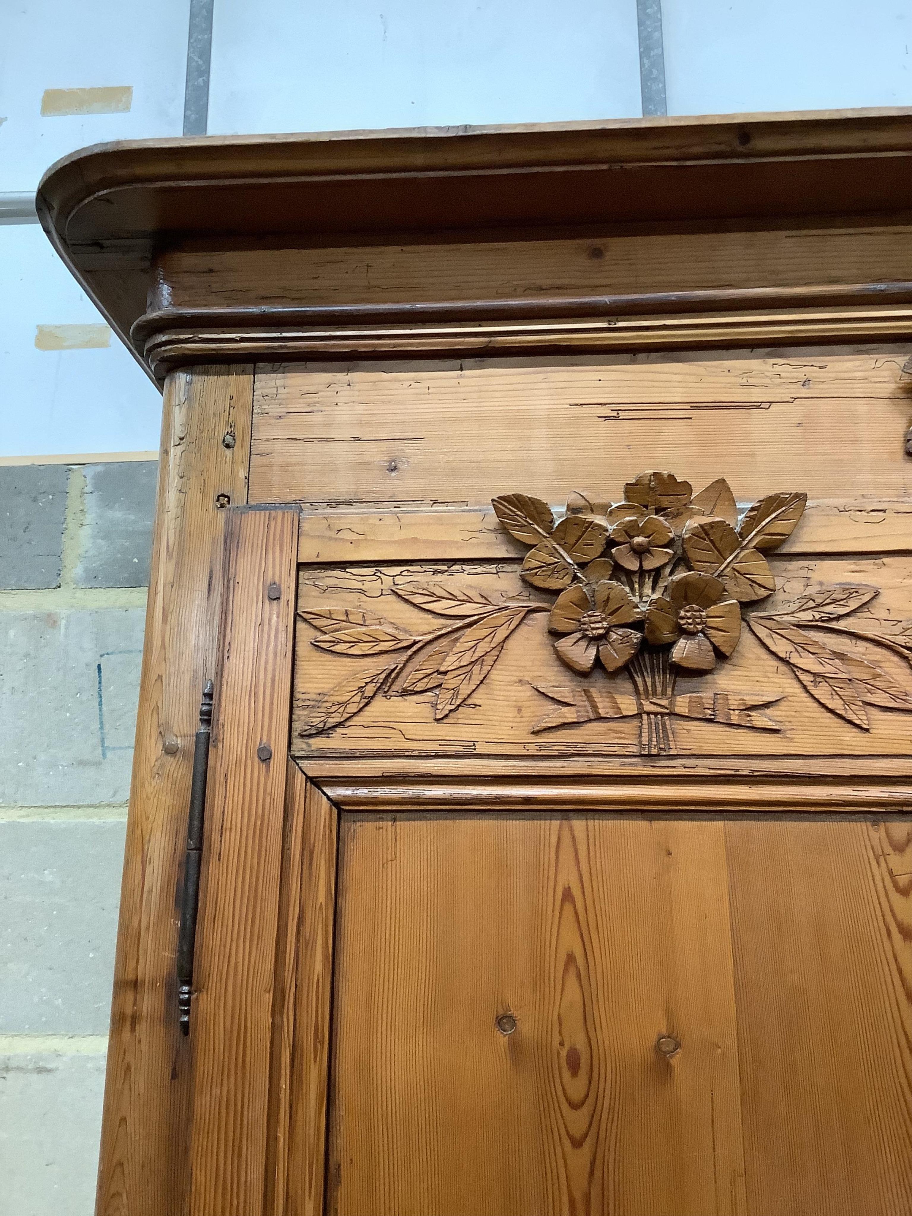 A 19th century French carved pine armoire, width 146cm, depth 58cm, height 218cm. Condition - fair